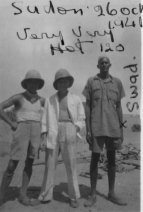 Man in Centre - Ernie Ward from London - the Squadron cook. Man on right - Sward - a local Sudanese who used to work in the camp.