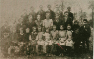 Her brother (Joe) is front row, far right.  Photo c 1933